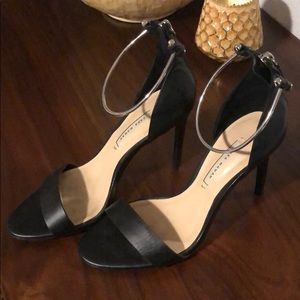 Zara black high heels with metal ankle strap.
